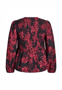 Sort bluse med lange ærmer, rød blomsterprint, rynket smock på den øverste ryg og elastiske manchetter og talje.