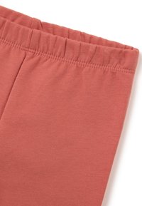 Katoenen blend, koraalkleurige leggings met een zachte textuur en elastische tailleband, met minimale stiksels en zonder extra patronen.