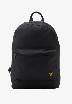 Black fabric backpack with a structured shape, front zip pocket, top handle, and a small yellow eagle logo on the lower front.