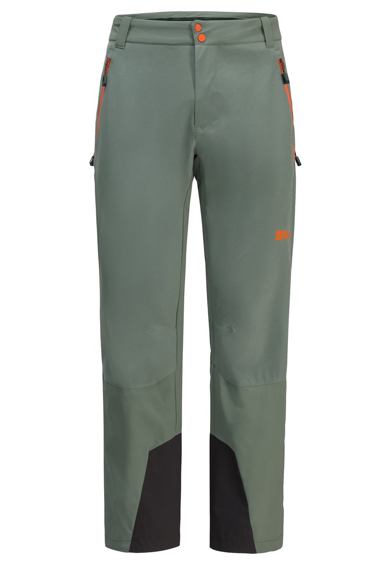 Grüne Outdoor-Hosen aus flexiblem Material, mit orangefarbenen Akzenten, einer Reißverschlusstasche und schwarzen Einsätzen an den Unterschenkeln.