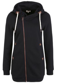 Felpa nera con zip, dotata di un ampio cappuccio, lacci color crema, dettagli in pelle marrone e tasche laterali. Tessuto morbido e polsini aderenti.