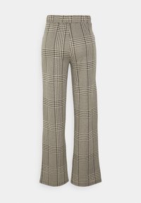 Checked wide-leg trousers in a beige and black pattern, featuring an elastic waistband and smooth texture, displayed from the back.