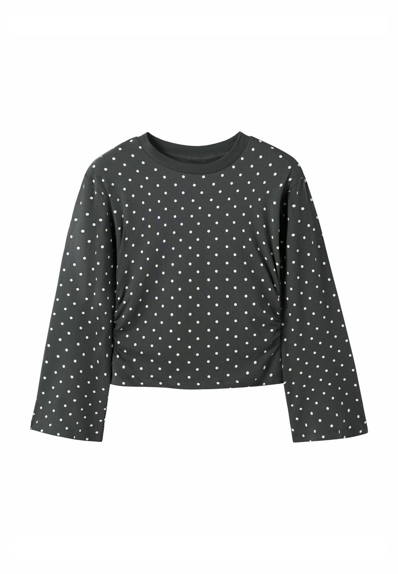 Lange mouwen, cropped top van donkergrijze stof met witte stippen. Heeft een ronde halslijn en een losse pasvorm met eenvoudige stiksel-details.