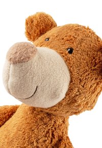 Plush bear toy with soft, orange-brown fur, a cream-colored muzzle and nose, black button eyes, and rounded ears. Textured fabric throughout.