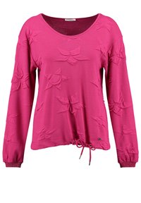 Fuchsia Langarmshirt mit V-Ausschnitt, strukturiertem Gewebe mit eingeprägten Sternmustern, gerafftem Taillenbereich mit Kordelzug und akzentuierten Ärmeln.