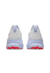 White athletic shoes with a textured upper, a grey heel, and red outsole. Features a speckled pattern on the midsole and pull tabs.