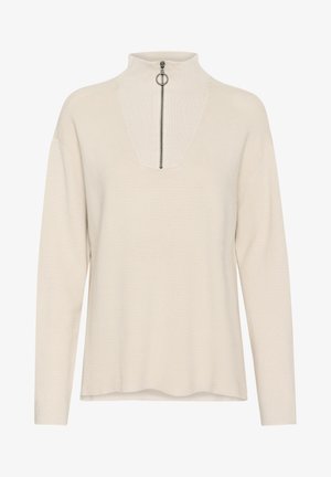 Helebeež pullover, millel on vale kaelus, osaline tõmblukk ees ja soonikuline tekstuur. Omab pikki varrukaid ja lõdve lõikega.