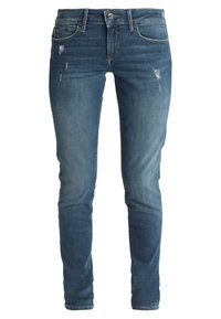Slim-fit jeans i mediumblå denim med subtila slitningar, midjekortliv, fem fickor och en mjuk tygtextur.