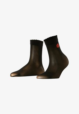 Chaussettes noires à la cheville avec un bord festonné, en matériau semi-transparent, et détail d'une rose brodée rouge sur un côté, présentant un design de pointe.