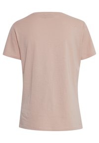 T-shirt à manches courtes, col ras du cou en coton doux et rose pâle. Texture lisse avec un design uni et sans marques ni motifs visibles.
