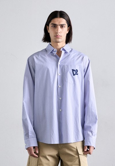 Blue and white striped button-up shirt, featuring a relaxed fit, cuffed sleeves, and a small navy logo on the chest pocket.