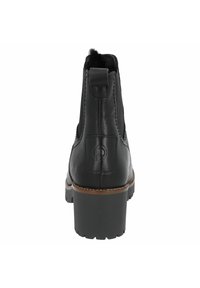 Bottine en cuir noir avec un talon texturé, une languette de tirage et des surpiqûres contrastantes en brun, dotée d'un intérieur rembourré pour plus de confort.