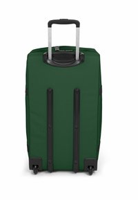 Zelená zavazadla s výsuvnou rukojetí, černými akcenty, texturovanou tkaninou a čtyřmi koly pro snadnou mobilitu. Disponuje zesíleným dnem.