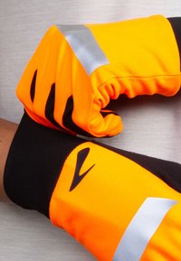 Bright orange gloves with black accents and silver reflective strips. Features ergonomic design with textured grip and flexible material.