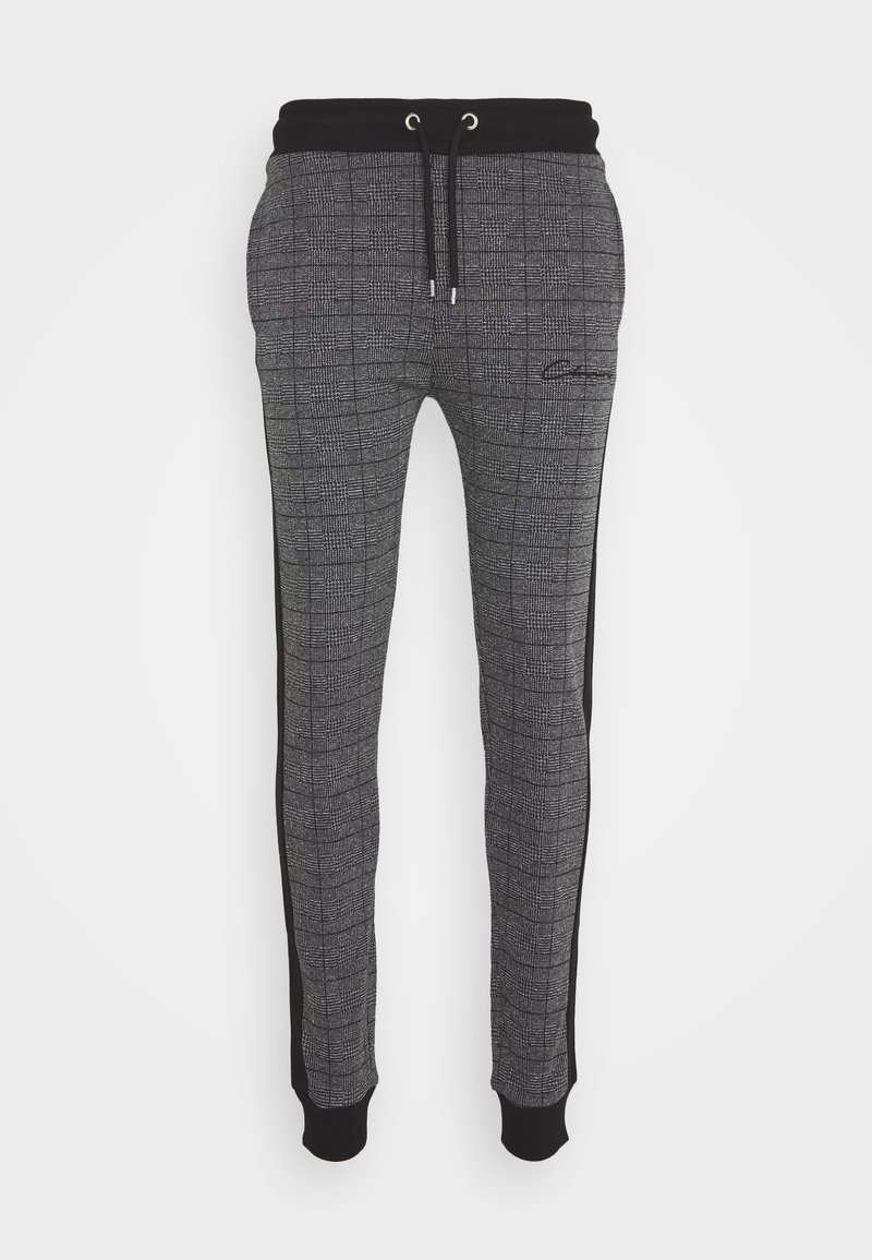 Grå rutiga sweatpants med svart midjeband och sidodetaljer, utrustade med elastiskt snörning och ankle cuffs.