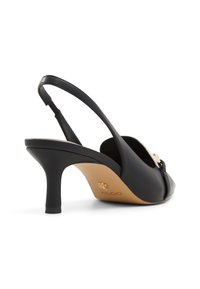 Black leather slingback shoe with a rounded toe, open front, and a 3-inch heel. Features a decorative gold hardware accent.