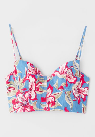 Blå blomstret crop top med store rosa og beige blomster, utformet med en hjerteformet halslinje og justerbare spaghetti-stropper.