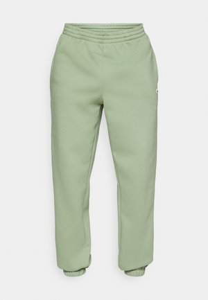 Světlé zelené joggery vyrobené z měkkého materiálu z bavlněné směsi. Disponují elastickým pasem a žebrovanými manžetami. Jednoduchý design bez viditelných vzorů.