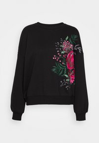 Sudadera negra de manga larga con puños y dobladillo acanalados, con un vibrante estampado floral rosa y hojas verdes en el lado derecho.