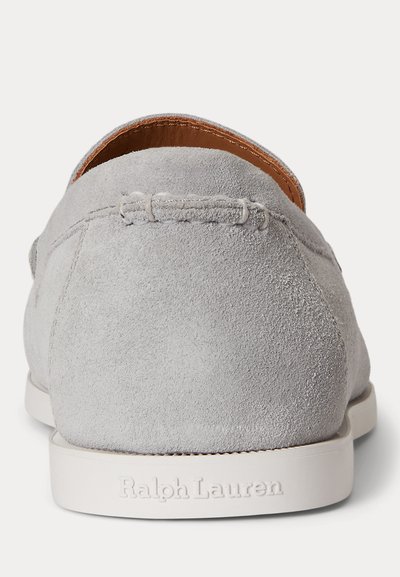 Light gray suede loafer with white sole featuring embossed "Ralph Lauren" logo on the heel, shown from the back.