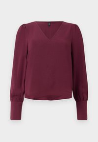 Burgundi värvi pluus V-kaelusega, pikkade puffkäiste ja elastsete mansettidega. Valmistatud kergest, tekstuurilisest kangast. Lihtne ja kaasaegne disain.