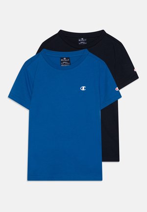 Two short-sleeve t-shirts: one blue and one black. Both made of soft cotton, with a round neck and a small logo on the chest.