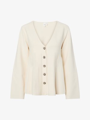 Bézs, hosszú ujjú kardigán V-nyakkal, öt díszgombbal és pleated elülső részletekkel. Puha kötött anyag.