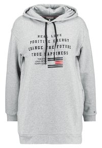 Haut à capuche gris avec une grande poche avant, un cordon de serrage à la capuche et du texte imprimé. Fabriqué dans un tissu doux avec une coupe oversize et décontractée.
