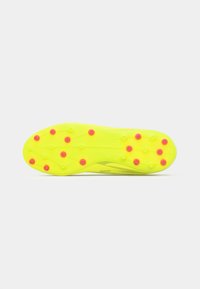 Bright yellow football boot sole with pink studs, featuring a textured surface and a streamlined design. Cleats arranged for traction.