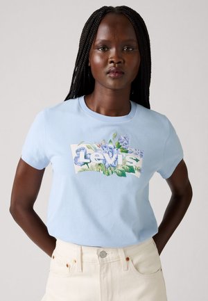 Light blue cotton t-shirt featuring a graphic design with floral elements and "Levi's" text, short sleeves, and a crew neck.