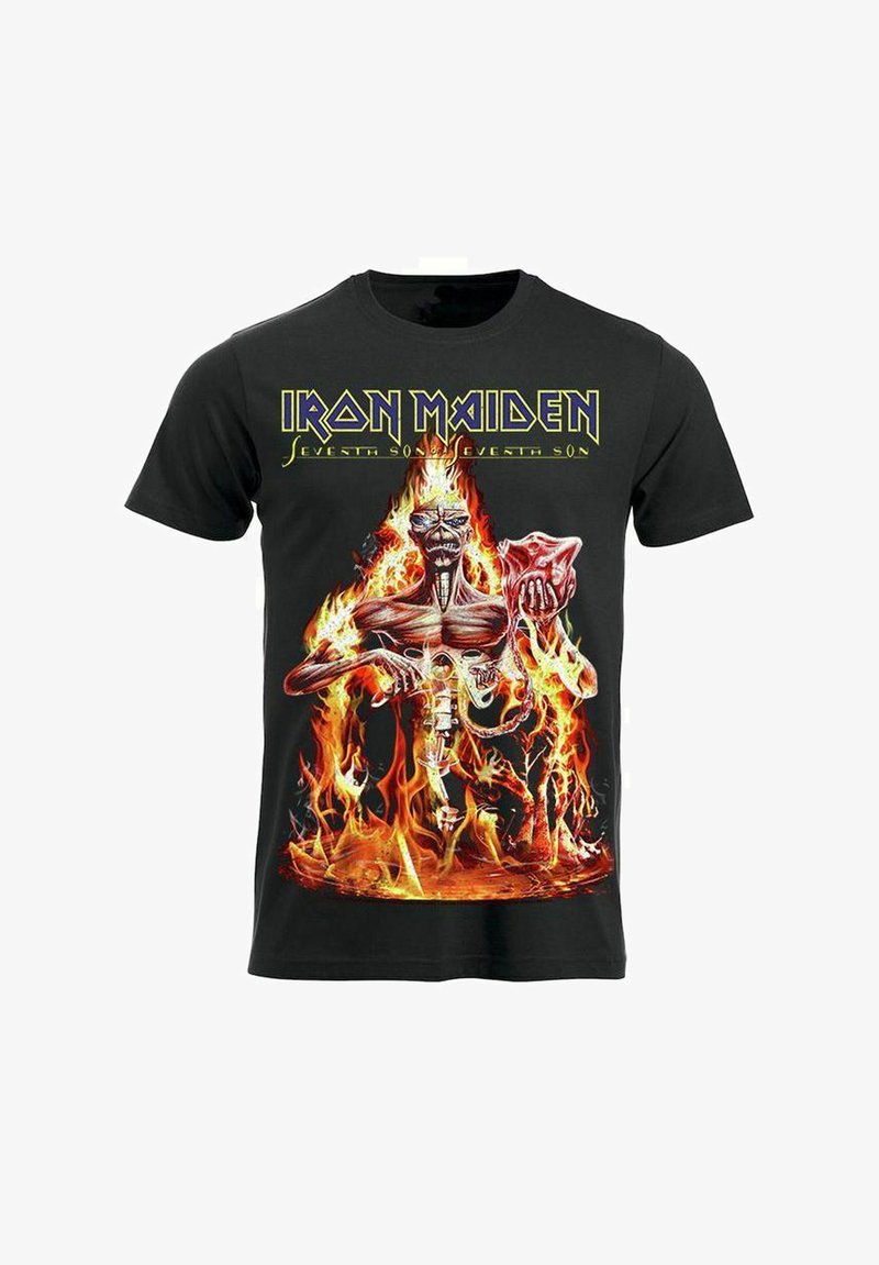 T-shirt en coton noir présentant un graphique vibrant d'une figure squelettique au milieu des flammes, avec le texte "Iron Maiden" et "Seventh Son" au-dessus.