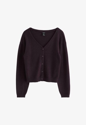 Cardigan corto a V in viola profondo, realizzato in morbido tessuto knit. Presenta una chiusura con bottoni sul davanti e maniche lunghe con polsini a coste.