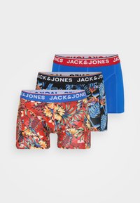 Three pairs of men's boxer shorts: red with tropical floral print, black with blue accents, and solid blue; all feature branded elastic waistbands.