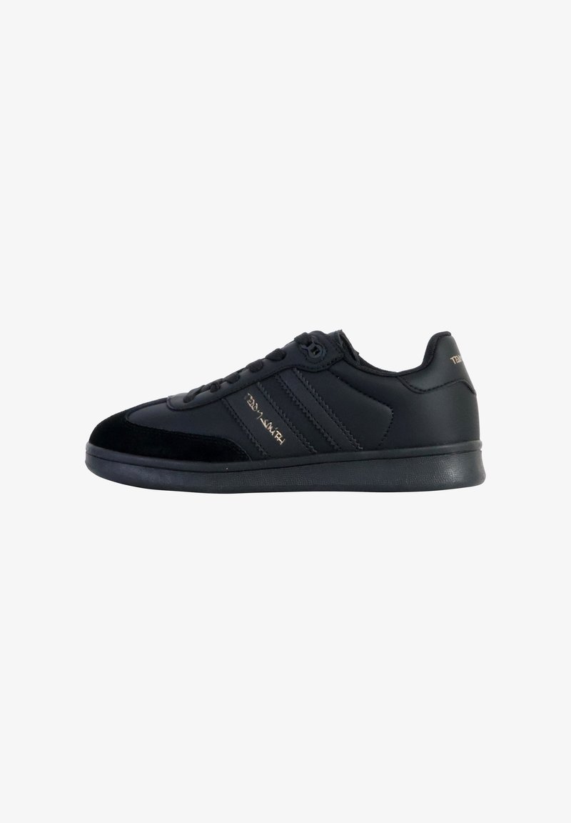 Black sneaker featuring a smooth leather upper with suede accents, lace closure, and a textured rubber sole. Gold logo detail on the side.