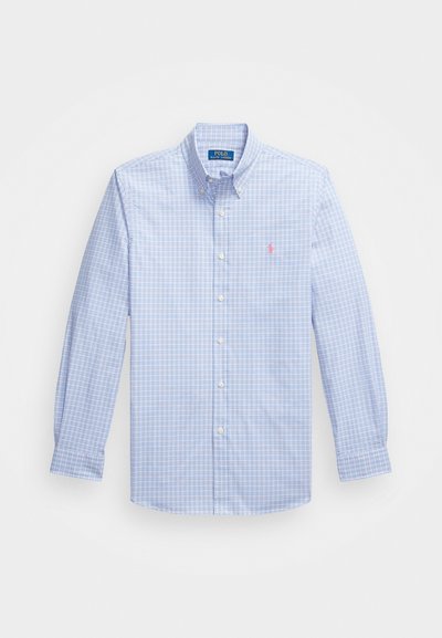 Gaiši zils rūtainas krekls ar garām piedurknēm, apkakli un mazu rozā logo kreisajā krūtī, izgatavots no austas kokvilnas auduma.