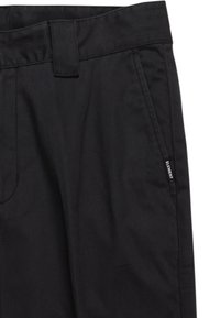 Black pants made from a textured material, featuring a flat waistband, side pockets, and a small branding tag on the side.