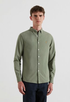 Langsleeve, knoopsluiting overhemd in olijfgroen. Gemaakt van gladde stof, met een button-down kraag en een klein geborduurd logo op de borst.