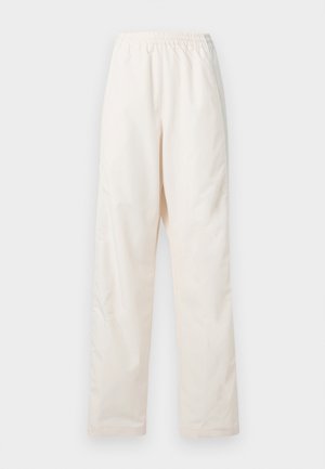 Vapaat, kuminauhavyötärölliset kermaan sävyiset housut, joissa on suora lahkeenleikkaus, valkoista taustaa vasten esitetty.