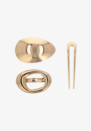 Tre accessori per capelli: una clip ovale color oro, una chiusura a cerchio attorcigliata e un sottile fermaglio per capelli. Tutti presentano una finitura metallica lucida.