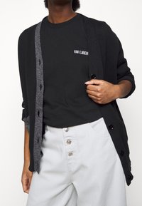 Han Kjøbenhavn Top s dlouhým rukávem - black