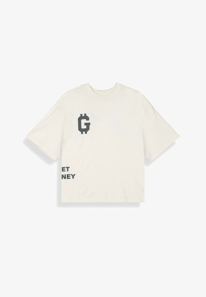 Camiseta extragrande color crema con una "G" pixelada negra y texto parcial en negro "ET NEY" en el frente, mangas cortas y cuello redondo.