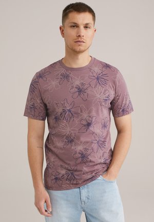 Kurzärmliges, mauvefarbenes T-Shirt mit einem floralem Muster in dunklerem Lila. Hergestellt aus weich stoff, mit Rundhalsausschnitt und entspannter Passform.