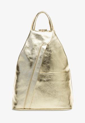 Gold metallic backpack with a structured, triangular design. Features a front pocket and two top handles. Smooth texture and shiny finish.