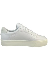 White leather sneaker with a streamlined design, textured upper, round toe, and low-profile white rubber outsole. Features subtle perforations.
