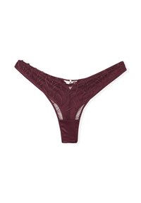 Tanga en dentelle bordeaux avec panneaux transparents, motif de broderie florale, bords festonnés et petite décoration centrale. Matière en mélange de coton.