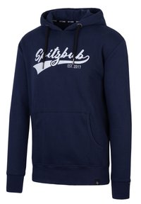 Marineblaue Kapuzenjacke aus weichem Material, mit einer frontalen Tasche, verstellbarem Kapuzenzug und weißen "Spitzbub EST. 2017" Druck.