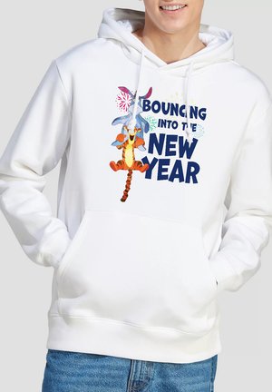 White hoodie with cartoon characters Eeyore and Tigger jumping, surrounded by colorful fireworks and text "Bouncing into the New Year."