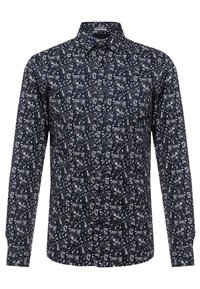 Camisa azul marino de mangas largas, con un estampado de cachemira en blanco y gris. Cuello abotonado, ajuste regular y tejido texturizado.