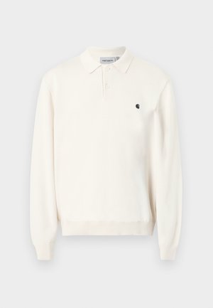 Kremowa koszulka polo z długim rękawem, dwoma guzikami, ściągaczami na mankietach, kołnierzykiem oraz małym czarnym logo Carhartt na lewej piersi.