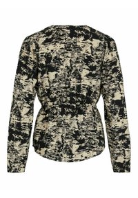 Blouse à manches longues avec motif abstrait noir et beige, taille élastique et épaules légèrement froncées vue de dos.